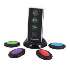 Buscador de llaves inalámbrico Localizador de llaves remoto 4 receptores 1 Estación de embarque Sistemas de alarma Seguridad para el hogar con linterna LED proveedor